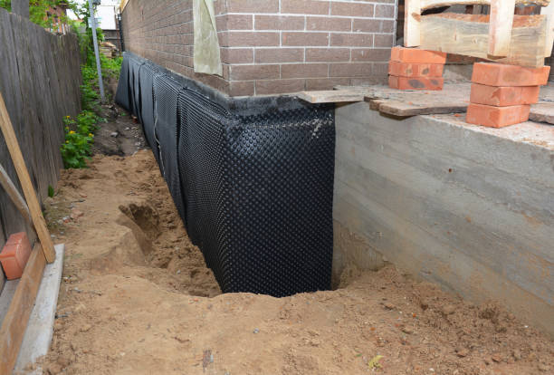Happy homeowners after waterproofing job in Pewaukee